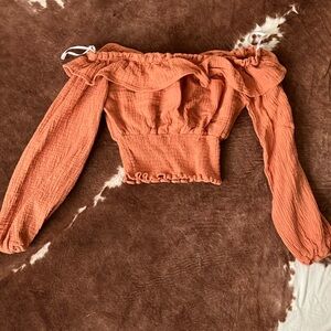 Western cropped blouse, burnt orangey coral, very cute just to small for me.